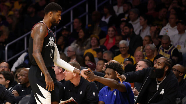 LOS ANGELES, CALIFORNIA - NOVEMBER 01: Paul George #13 of the Los Angeles Clippers high fives teammate James Harden #1 on the bench during the fourth quarter against the Los Angeles Lakers at Crypto.com Arena on November 01, 2023 in Los Angeles, California.