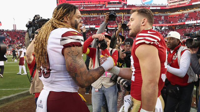 SANTA CLARA, CALIFORNIA - DECEMBER 24: Chase Young #99 of the Washington Commanders talks to Nick Bosa #97 of the San Francisco 49ers after the game at Levi's Stadium on December 24, 2022 in Santa Clara, California.
