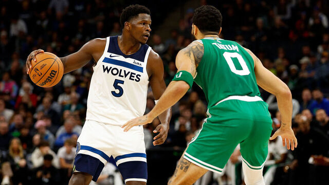 MINNEAPOLIS, MINNESOTA - NOVEMBER 06: Anthony Edwards #5 of the Minnesota Timberwolves dribbles the ball while Jayson Tatum #0 of the Boston Celtics defends in the second quarter at Target Center on November 06, 2023 in Minneapolis, Minnesota.