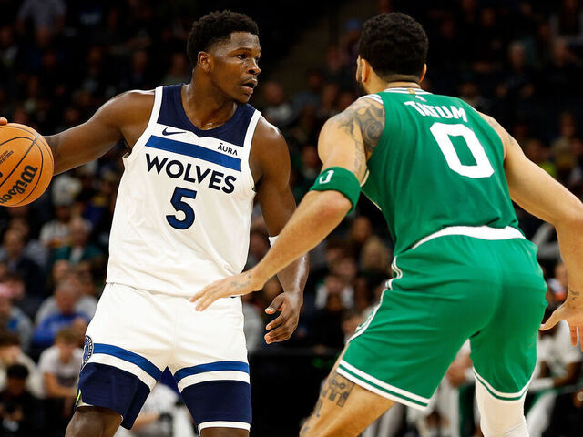 MINNEAPOLIS, MINNESOTA - NOVEMBER 06: Anthony Edwards #5 of the Minnesota Timberwolves dribbles the ball while Jayson Tatum #0 of the Boston Celtics defends in the second quarter at Target Center on November 06, 2023 in Minneapolis, Minnesota.