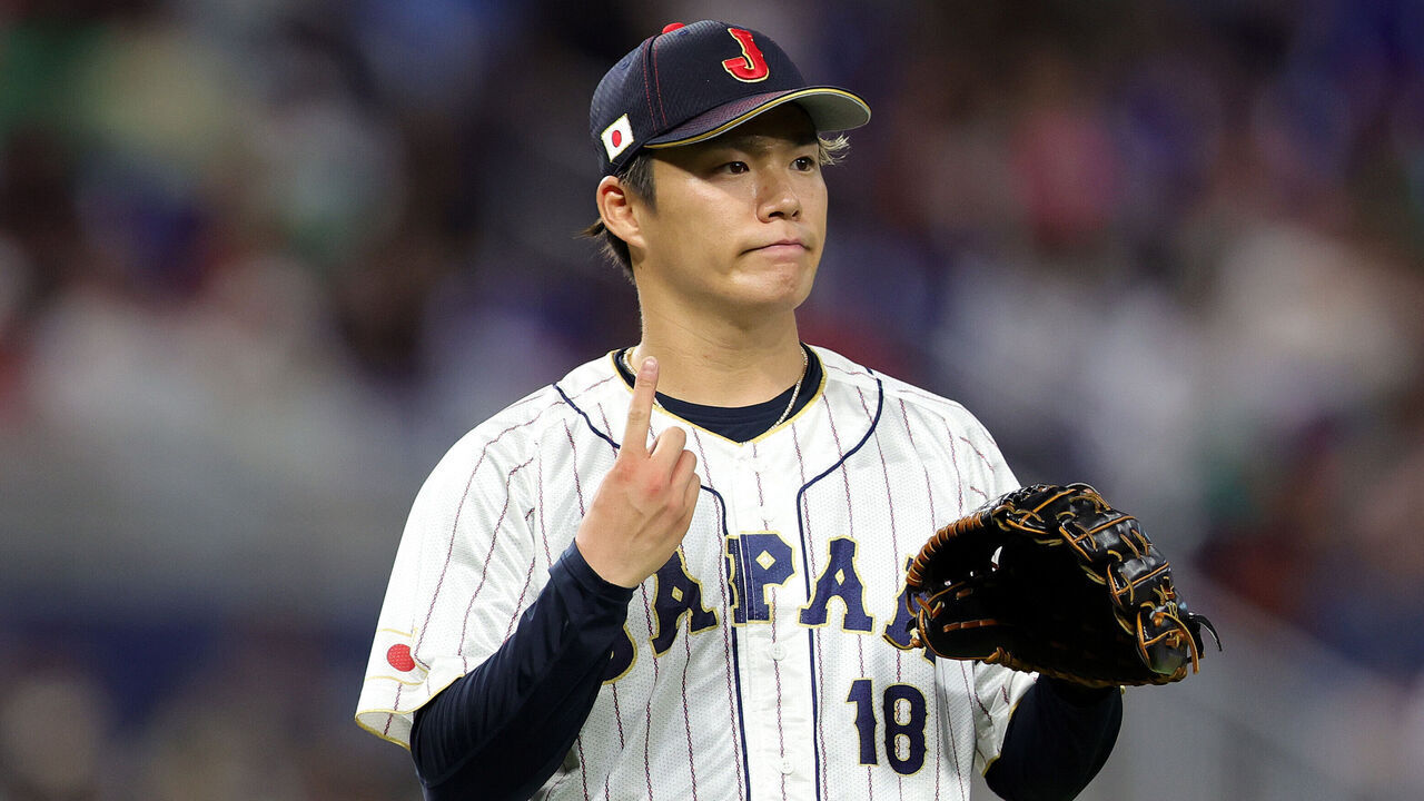 MIAMI, FLORIDA - MARCH 20: Yoshinobu Yamamoto #18 of Team Japan reacts in the fifth inning against Team Mexico during the World Baseball Classic Semifinals at loanDepot park on March 20, 2023 in Miami, Florida.