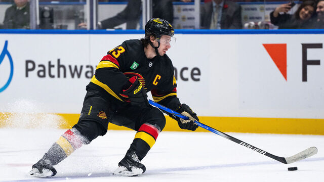 VANCOUVER, BC - OCTOBER 31: Vancouver Canucks defenseman Quinn Hughes (43) skates with the puck the Vancouver Canucks game versus the Nashville Predators on October 31, 2023, at Rogers Arena in Vancouver, B.C.