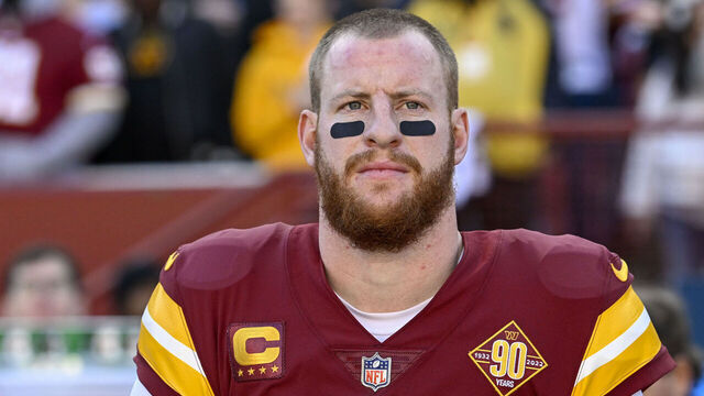 LANDOVER, MD - JANUARY 1: Washington Commanders quarterback Carson Wentz (11) stands for the national anthem prior to his start against the Cleveland Browns at FedEx Field on January 1, 2023.