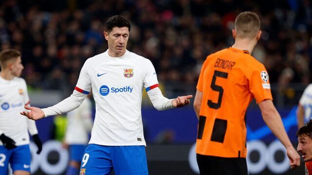 Barcelona's Polish forward #09 Robert Lewandowski (L) reacts next to Shakhtar Donetsk's Ukrainian defender #05 Valeriy Bondar during the UEFA Champions League Group H football match between FC Shakhtar Donetsk and FC Barcelona in Hamburg, northern Germany on November 7, 2023.