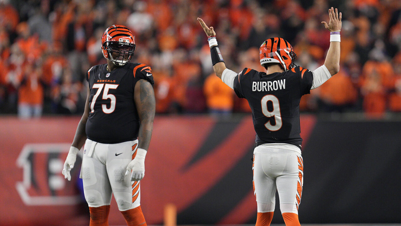 CINCINNATI, OHIO - NOVEMBER 05: Joe Burrow #9 and Orlando Brown Jr. #75 of the Cincinnati Bengals react after getting a first down in the fourth quarter of a NFL football game against the Buffalo Bills at Paycor Stadium on November 05, 2023 in Cincinnati, Ohio.