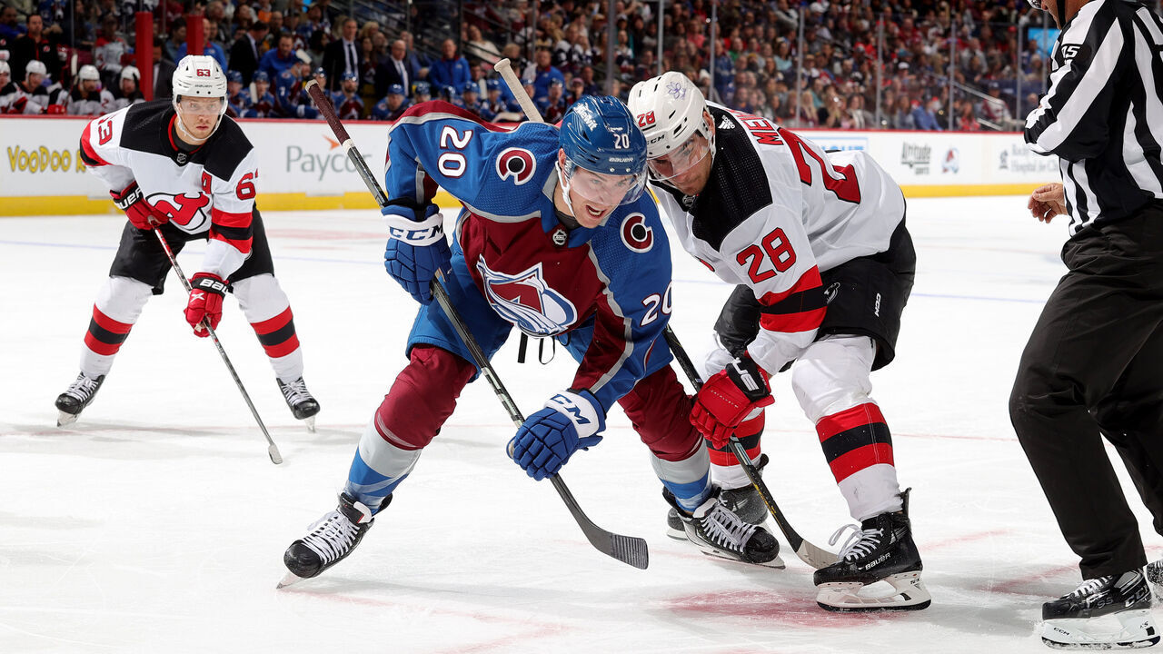 DENVER, COLORADO - NOVEMBER 07: Ross Colton #20 of the Colorado Avalanche faces off against Timo Meier #28 of the New Jersey Devils at Ball Arena on November 7, 2023 in Denver, Colorado.