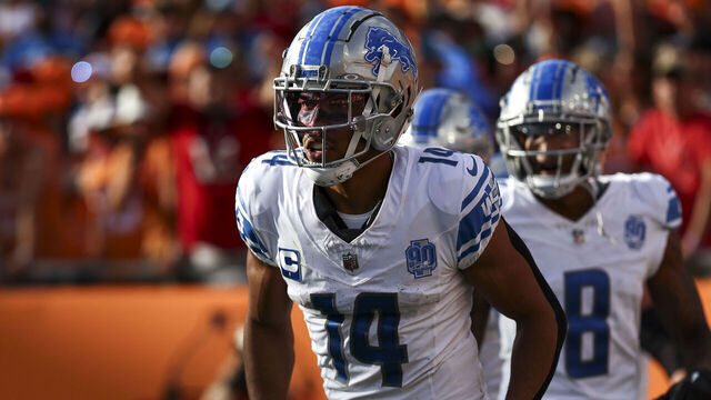 TAMPA, FL - OCTOBER 15: Amon-Ra St. Brown #14 of the Detroit Lions celebrates with teammates after scoring a touchdown during the second quarter of an NFL football game against the Tampa Bay Buccaneers at Raymond James Stadium on October 15, 2023 in Tampa, Florida.