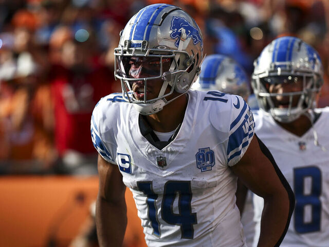 TAMPA, FL - OCTOBER 15: Amon-Ra St. Brown #14 of the Detroit Lions celebrates with teammates after scoring a touchdown during the second quarter of an NFL football game against the Tampa Bay Buccaneers at Raymond James Stadium on October 15, 2023 in Tampa, Florida.