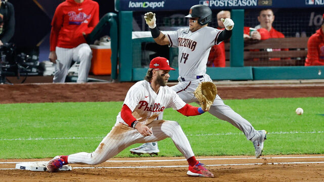 PHILADELPHIA, PA - OCTOBER 17: Bryce Harper #3 of the Philadelphia Phillies tags out Gabriel Moreno #14 of the Arizona Diamondbacks at first base in the second inning during Game 2 of the NLCS between the Arizona Diamondbacks and the Philadelphia Phillies at Citizens Bank Park on Tuesday, October 17, 2023 in Philadelphia, Pennsylvania.