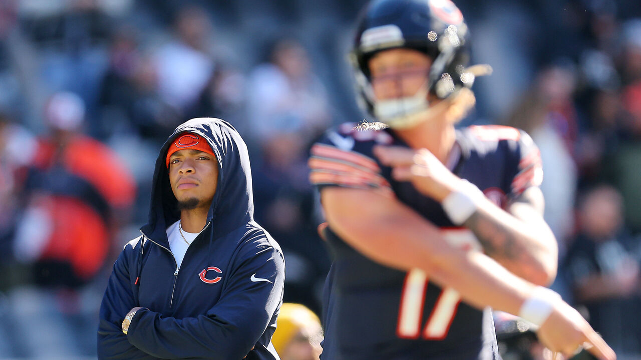 CHICAGO, ILLINOIS - OCTOBER 22: Justin Fields #1 of the Chicago Bears watches warm ups before the game against the Las Vegas Raiders at Soldier Field on October 22, 2023 in Chicago, Illinois.