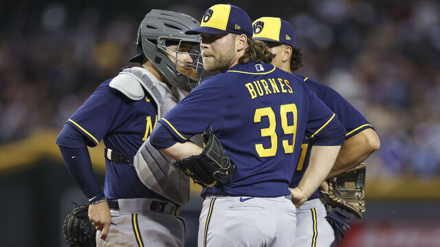 PHOENIX, AZ - APRIL 11: Milwaukee Brewers starting pitcher Corbin Burnes (39) meets on the mound with catcher Victor Caratini (7) and shortstop Willy Adames (27) during a regular season game between the Milwaukee Brewers and Arizona Diamondbacks on April 11, 2023 at Chase Field in Phoenix, AZ.