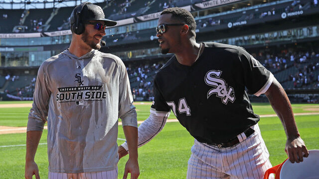 CHICAGO, ILLINOIS - JULY 03: Eloy Jimenez #74 of the Chicago White Sox (R) congratulates Dylan Cease #84 after Cease got his first Major League win in his Major League debut against the Detroit Tigers at Guaranteed Rate Field on July 03, 2019 in Chicago, Illinois. The White Sox defeated the Tigers 7-5.