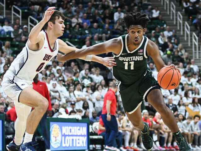 EAST LANSING, MI - NOVEMBER 09: Michigan State Spartans guard A.J. Hoggard (11) drives to the basket against Southern Indiana guard Ryan Hall (0) during a college basketball game between the Michigan State Spartans and Southern Indiana Screaming Eagles on November 9, 2023 at the Breslin Center in East Lansing, MI.