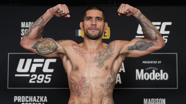 NEW YORK, NEW YORK - NOVEMBER 10: Alex Pereira of Brazil poses on the scale during the UFC 295 official weigh-in at New York Marriott Marquis on November 10, 2023 in New York City.