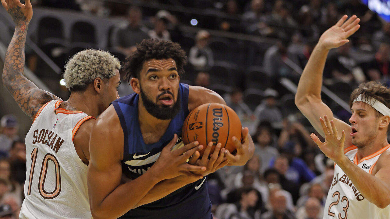SAN ANTONIO, TX - NOVEMBER 10: Karl-Anthony Towns #32 of the Minnesota Timberwolves battles Jeremy Sochan #10 of the San Antonio Spurs for a rebound in the first half of an NBA In-Season Tournament at Frost Bank Center on November 10, 2023 in San Antonio, Texas. NOTE TO USER: User expressly acknowledges and agrees that, by downloading and or using this photograph, User is consenting to terms and conditions of the Getty Images License Agreement.