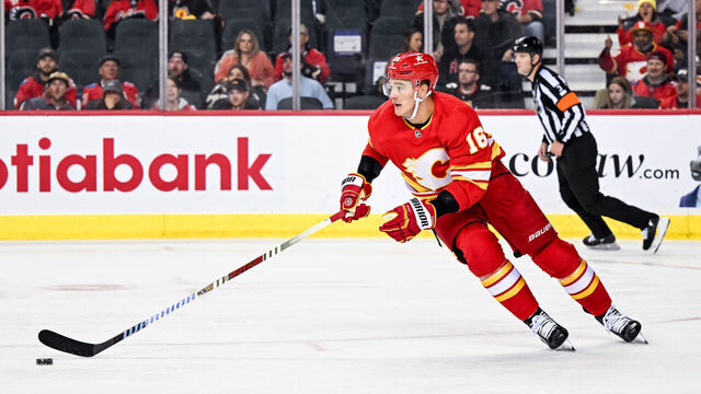 CALGARY, AB - NOVEMBER 07: Calgary Flames Defenceman Nikita Zadorov (16) skates with the puck during the second period of an NHL game between the Calgary Flames and the Nashville Predators on November 7, 2023, at the Scotiabank Saddledome in Calgary, AB.