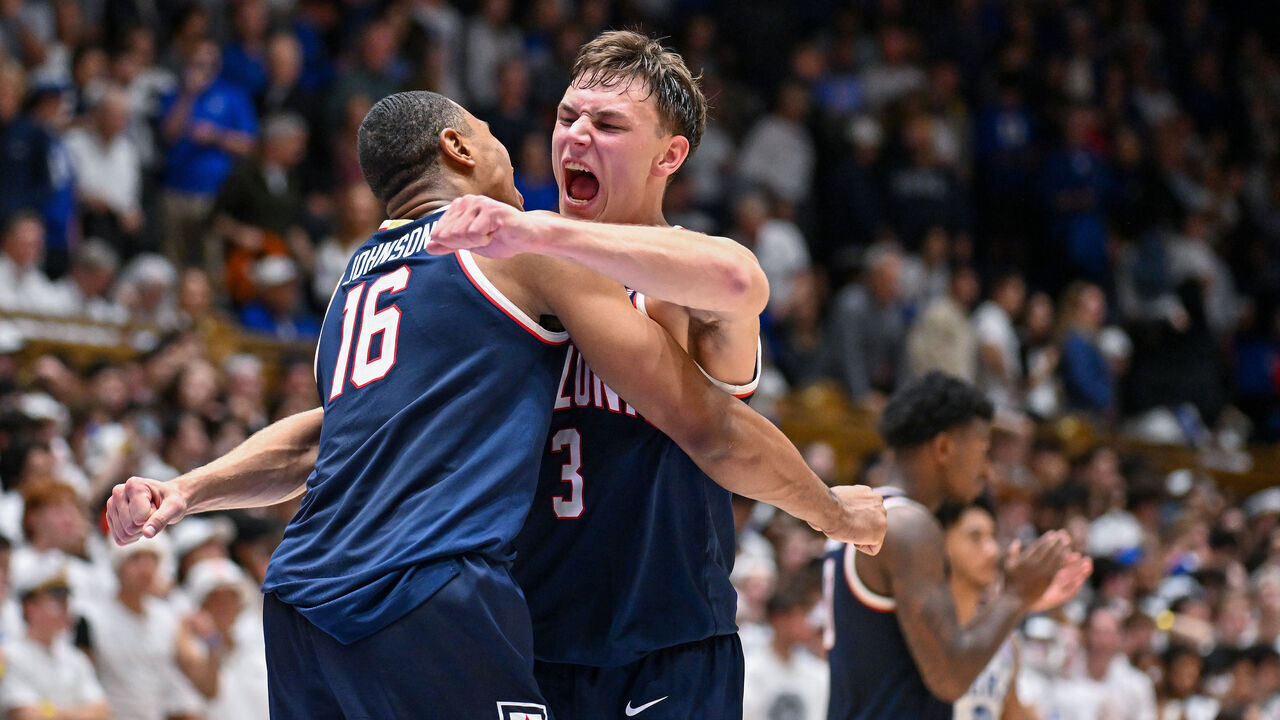 DURHAM, NORTH CAROLINA - NOVEMBER 10: Keshad Johnson #16 and Pelle Larsson #3 of the Arizona Wildcats celebrate after a win against the Duke Blue Devils at Cameron Indoor Stadium on November 10, 2023 in Durham, North Carolina. Arizona won 78-73.
