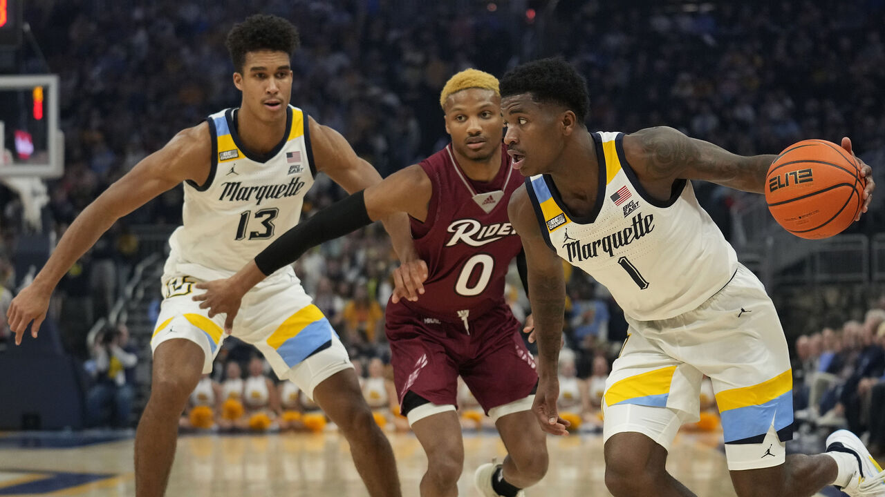 MILWAUKEE, WISCONSIN - NOVEMBER 10: Kam Jones #1 of the Marquette Golden Eagles dribbles the ball against the Rider Broncs in the first half at Fiserv Forum on November 10, 2023 in Milwaukee, Wisconsin.