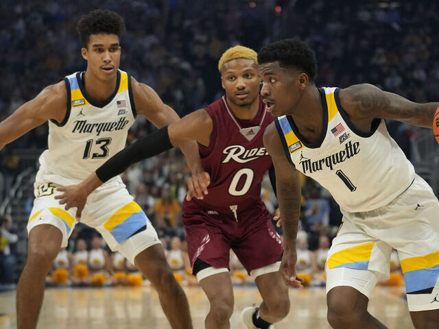 MILWAUKEE, WISCONSIN - NOVEMBER 10: Kam Jones #1 of the Marquette Golden Eagles dribbles the ball against the Rider Broncs in the first half at Fiserv Forum on November 10, 2023 in Milwaukee, Wisconsin.