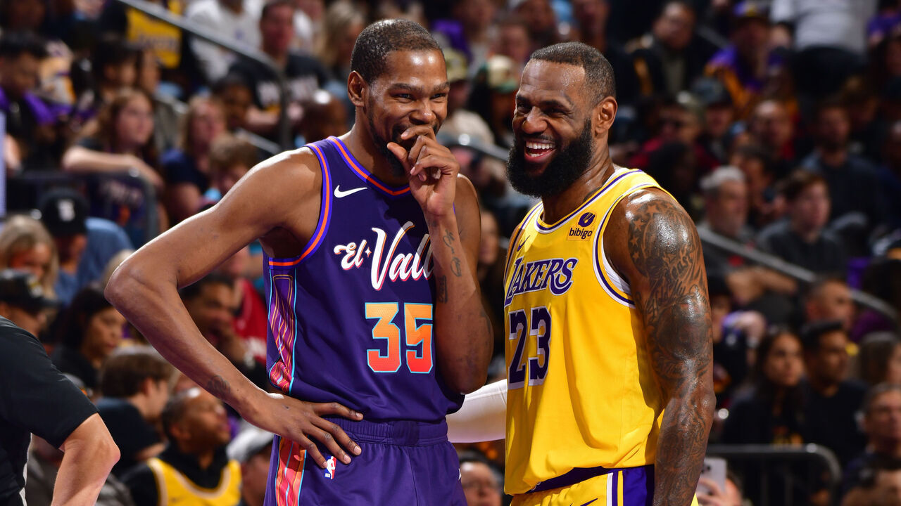 PHOENIX, AZ - NOVEMBER 10: Kevin Durant #35 of the Phoenix Suns and LeBron James #23 of the Los Angeles Lakers smile during the game during the In-Season Tournament on November 10, 2023 at Footprint Center in Phoenix, Arizona. Mandatory Copyright Notice: Copyright 2023 NBAE