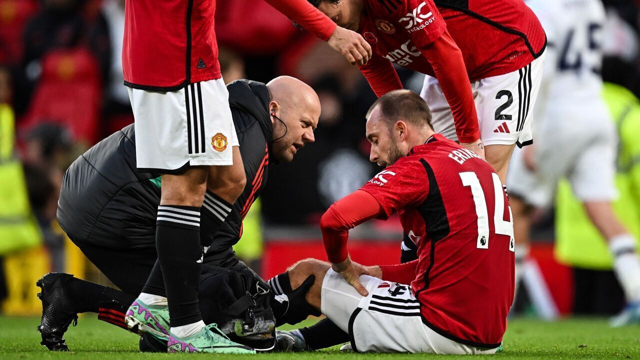 Manchester United's Danish midfielder #14 Christian Eriksen receives medical attention during the English Premier League football match between Manchester United and Luton Town at Old Trafford in Manchester, north west England, on November 11, 2023.