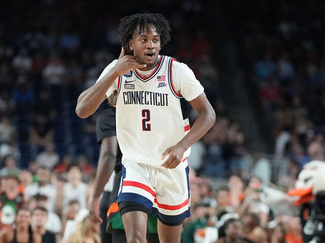 HOUSTON, TEXAS - APRIL 01: Tristen Newton #2 of the Connecticut Huskies celebrates a shot during the NCAA Men's Basketball Tournament Final Four semifinal game against the Miami (Fl) Hurricanes at NRG Stadium on April 01, 2023 in Houston, Texas.