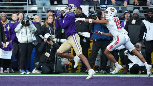 SEATTLE, WA - NOVEMBER 11: Washington Huskies wide receiver Rome Odunze (1) pulls in a pass for a Washington touchdown in front of Utah Utes cornerback Tao Johnson (15) during a PAC12 game between the Washington Huskies and the Utah Utes on Nov 11, 2023 at Husky Stadium in Seattle, WA.
