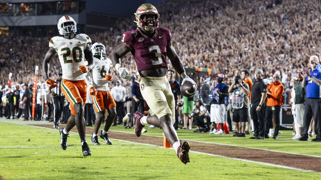 TALLAHASSEE, FLORIDA - NOVEMBER 11: Trey Benson #3 of the Florida State Seminoles scores a touchdown during the second half of a game against the Miami Hurricanes at Doak Campbell Stadium on November 11, 2023 in Tallahassee, Florida.