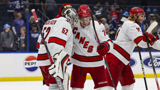 TAMPA, FL - NOVEMBER 11: Goalie Pyotr Kochetkov #52 and Brady Skjei #76 of the Carolina Hurricanes celebrate the win against the Tampa Bay Lightning at Amalie Arena on November 11, 2023 in Tampa, Florida.