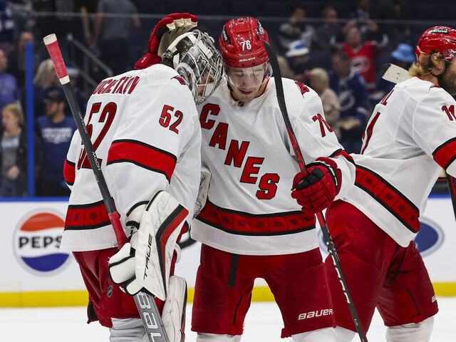 TAMPA, FL - NOVEMBER 11: Goalie Pyotr Kochetkov #52 and Brady Skjei #76 of the Carolina Hurricanes celebrate the win against the Tampa Bay Lightning at Amalie Arena on November 11, 2023 in Tampa, Florida.