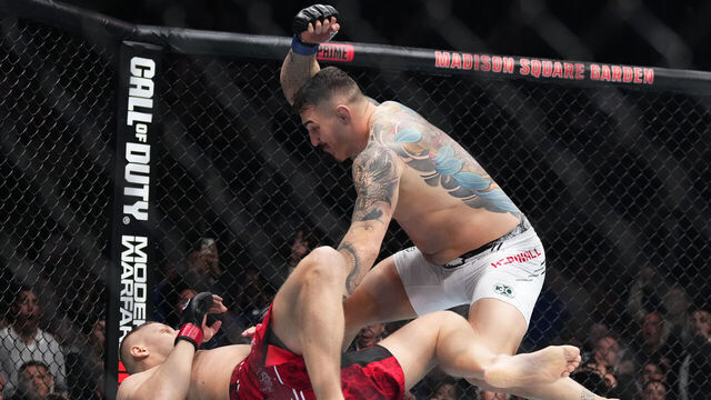 NEW YORK, NEW YORK - NOVEMBER 11: Tom Aspinall of England knocks down Sergei Pavlovich of Russia in the interim UFC heavyweight championship fight during the UFC 295 event at Madison Square Garden on November 11, 2023 in New York City.