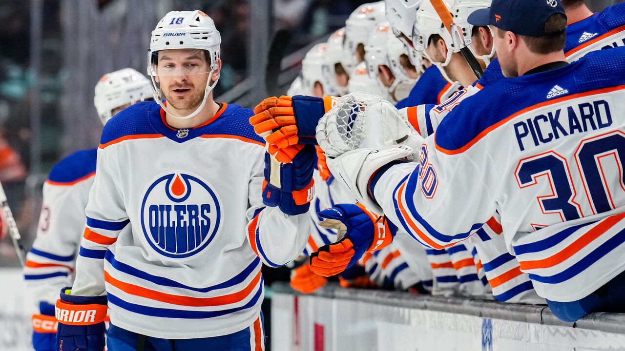 SEATTLE, WASHINGTON - NOVEMBER 11: Zach Hyman #18 of the Edmonton Oilers celebrates with teammates after scoring a goal during the first period of a game against the Seattle Kraken at Climate Pledge Arena on November 11, 2023 in Seattle, Washington.