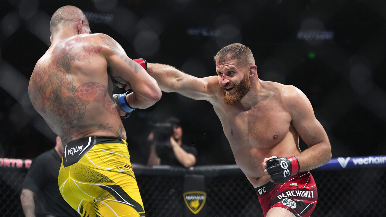 SALT LAKE CITY, UTAH - JULY 29: (R-L) Jan Blachowicz of Poland punches Alex Pereira of Brazil in a light heavyweight fight during the UFC 291 event at Delta Center on July 29, 2023 in Salt Lake City, Utah.