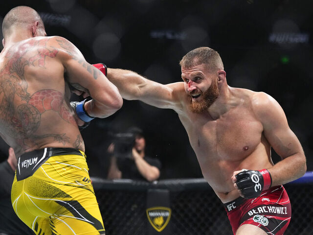 SALT LAKE CITY, UTAH - JULY 29: (R-L) Jan Blachowicz of Poland punches Alex Pereira of Brazil in a light heavyweight fight during the UFC 291 event at Delta Center on July 29, 2023 in Salt Lake City, Utah.