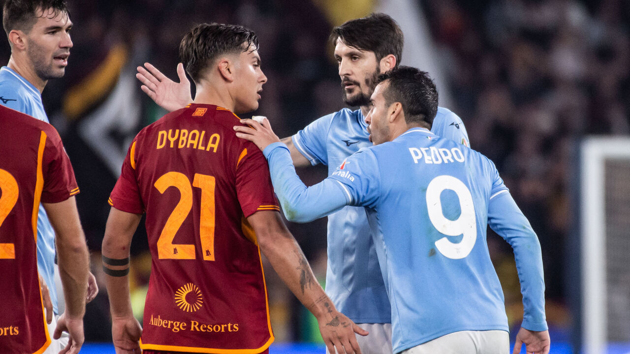 ROME, ITALY - NOVEMBER 12: Paulo Dybala of AS Roma, Luis Alberto and Pedro of SS Lazio they debate during the Serie A TIM match between SS Lazio and AS Roma at Stadio Olimpico on November 12, 2023 in Rome, Italy.