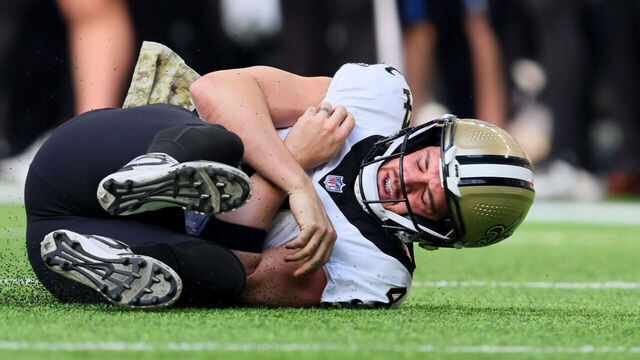 MINNEAPOLIS, MINNESOTA - NOVEMBER 12: Derek Carr #4 of the New Orleans Saints is tackled by Danielle Hunter #99 of the Minnesota Vikings during the second quarter at U.S. Bank Stadium on November 12, 2023 in Minneapolis, Minnesota.