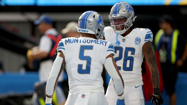 INGLEWOOD, CALIFORNIA - NOVEMBER 12: Jahmyr Gibbs #26 of the Detroit Lions celebrates a touchdown with David Montgomery #5 of the Detroit Lions during the first quarter against the Los Angeles Chargers at SoFi Stadium on November 12, 2023 in Inglewood, California.