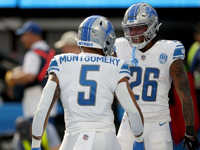 INGLEWOOD, CALIFORNIA - NOVEMBER 12: Jahmyr Gibbs #26 of the Detroit Lions celebrates a touchdown with David Montgomery #5 of the Detroit Lions during the first quarter against the Los Angeles Chargers at SoFi Stadium on November 12, 2023 in Inglewood, California.