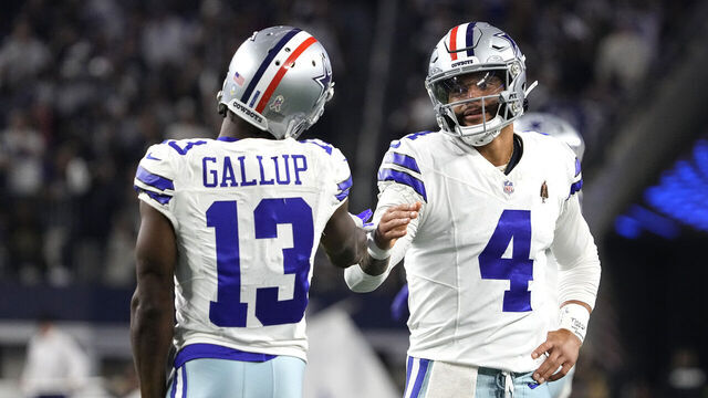 ARLINGTON, TEXAS - NOVEMBER 12: Dak Prescott #4 of the Dallas Cowboys celebrates a touchdown pass with Michael Gallup #13 of the Dallas Cowboys during the third quarter against the New York Giants at AT&T Stadium on November 12, 2023 in Arlington, Texas.
