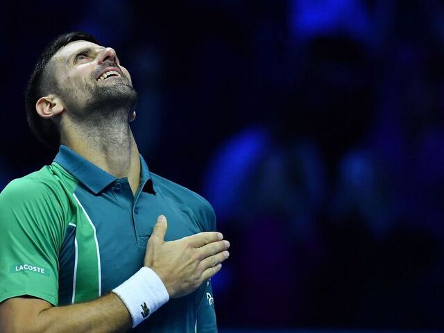 Serbia's Novak Djokovic celebrates after winning the first round-robin match against Denmark's Holger Rune at the ATP Finals tennis tournament in Turin on November 12, 2023.