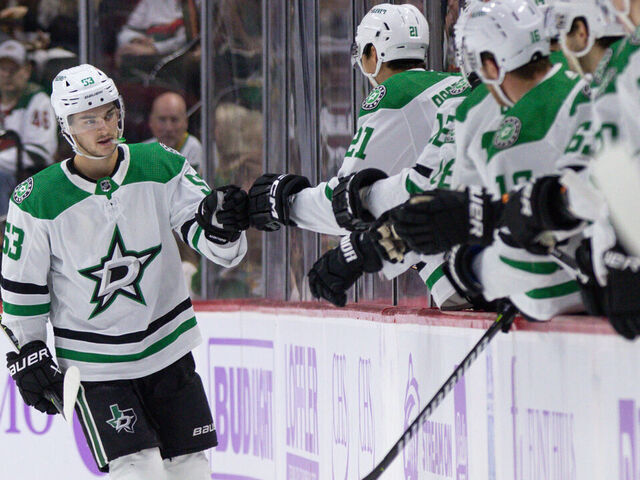 SAINT PAUL, MN - NOVEMBER 12: Dallas Stars center Wyatt Johnston (53) gives teammates fist bumps after a goal during the NHL game between the Dallas Stars and Minnesota Wild on November 12th, 2023, at the Xcel Energy Center in Saint Paul, MN.