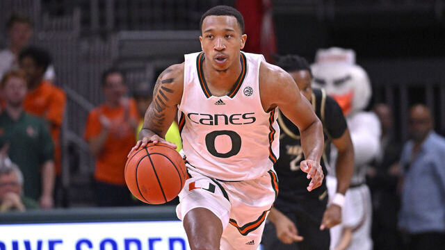 CORAL GABLES, FL - NOVEMBER 10: Miami guard Matthew Cleveland (0) handles the ball in the first half as the Miami Hurricanes faced the UCF Knights on November 10, 2023, at the Watsco Center in Coral Gables, Florida.