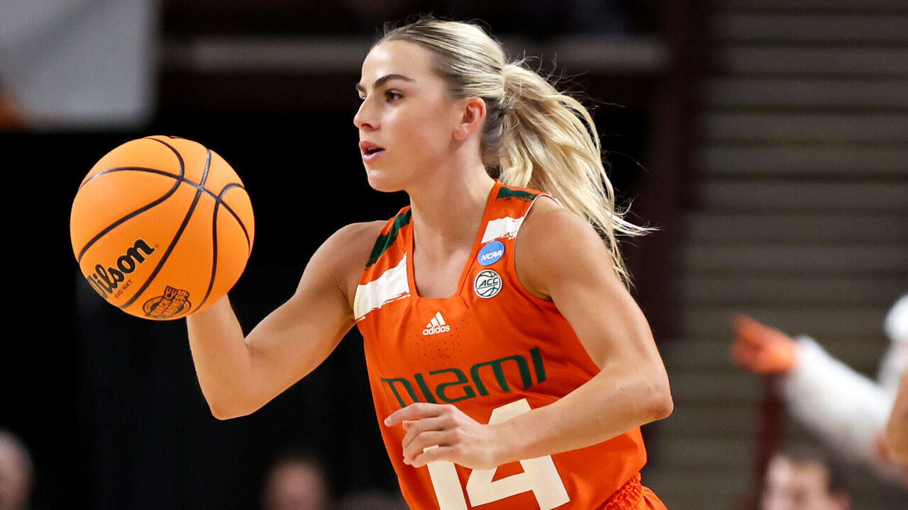 GREENVILLE, SOUTH CAROLINA - MARCH 26: Haley Cavinder #14 of the Miami Hurricanes dribbles the ball against the LSU Lady Tigers during the first quarter in the Elite Eight round of the NCAA Women's Basketball Tournament at Bon Secours Wellness Arena on March 26, 2023 in Greenville, South Carolina.
