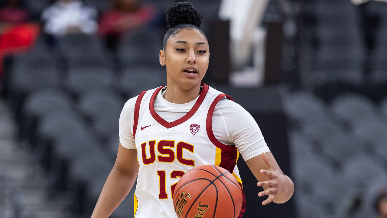 LAS VEGAS, NEVADA - NOVEMBER 6: JuJu Watkins #12 of the USC Trojans brings the ball up court against the Ohio State Buckeyes during the Naismith Hall of Fame Series at T-Mobile Arena on November 6, 2023 in Las Vegas, Nevada.