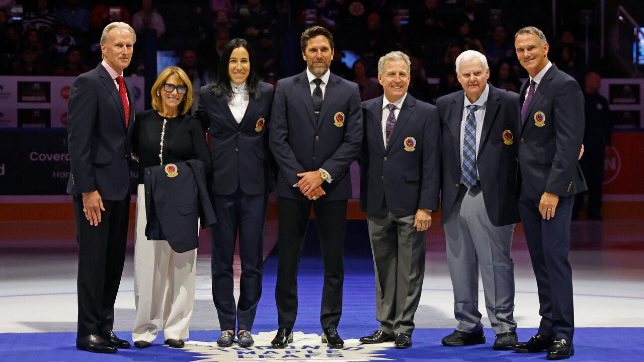 TORONTO, CANADA - NOVEMBER 12: (L-R) Tom Barrasso, Coco Lacroix (for Pierre), Caroline Ouellett, Henrik Lundqvist, Mike Vernon, Ken Hitchcock and Pierre Turgeon receive their Hockey Hall of Fame blazers at Air Canada Centre on November 12, 2023 in Toronto, Ontario, Canada.