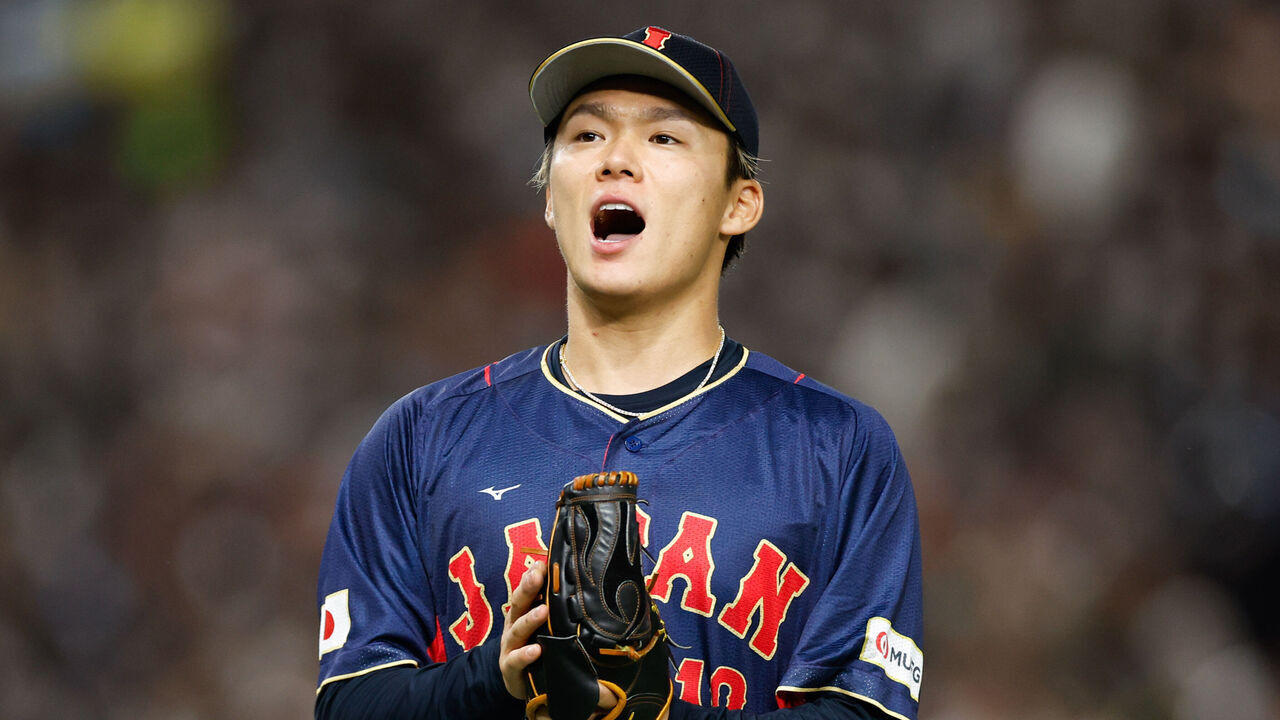 BUNKYO CITY, JAPAN - MARCH 12: Yoshinobu Yamamoto #18 of Team Japan reacts while pitching during Game 8 of Pool B between Team Japan and Team Australia at Tokyo Dome on Sunday, March 12, 2023 in Bunkyo City, Japan.