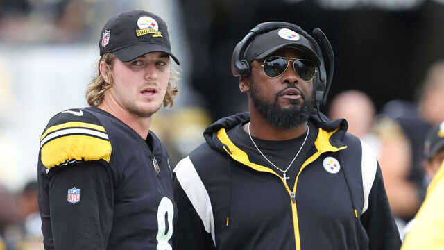 PITTSBURGH, PA - OCTOBER 2: Kenny Pickett #8 of the Pittsburgh Steelers and head coach Mike Tomlin talk on the sideline against the New York Jets during a game at Acrisure Stadium on October 2, 2022 in Pittsburgh, Pennsylvania.