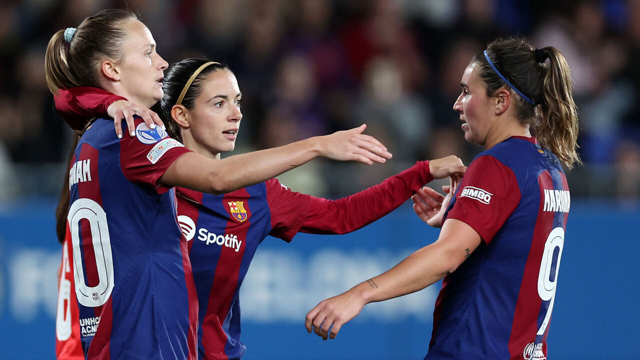 BARCELONA, SPAIN - NOVEMBER 14: Aitana Bonmati of FC Barcelona (C) celebrates after scoring the team's fourth goal with teammates Mariona Caldentey (R) and Caroline Graham Hansen during the UEFA Women's Champions League group stage match between FC Barcelona and SL Benfica at Estadi Johan Cruyff on November 14, 2023 in Barcelona, Spain.