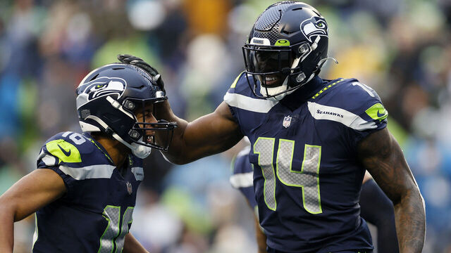 SEATTLE, WASHINGTON - JANUARY 02: DK Metcalf #14 of the Seattle Seahawks celebrates his touchdown catch with Tyler Lockett #16 during the third quarter against the Detroit Lions at Lumen Field on January 02, 2022 in Seattle, Washington.