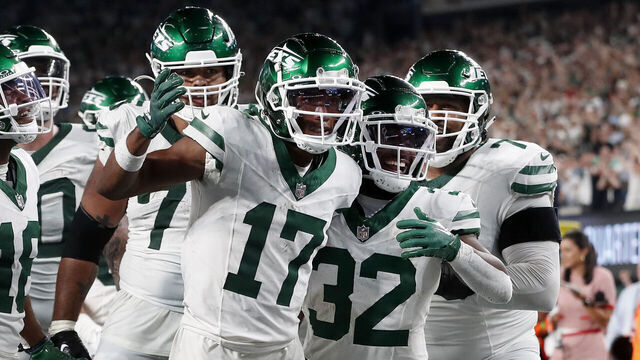 EAST RUTHERFORD, NEW JERSEY - SEPTEMBER 11: (NEW YORK DAILIES OUT) Garrett Wilson #17 of the New York Jets celebrates his fourth quarter touchdown against the Buffalo Bills with his teammates at MetLife Stadium on September 11, 2023 in East Rutherford, New Jersey. The Jets defeated the Bills 22-16 in overtime.